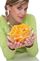 Healthy lifestyle series - Woman holding bowl with oranges