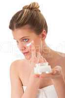 Body care series - Blond woman applying cream