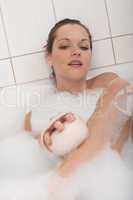 Body care series - Young woman having bath