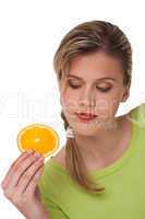 Healthy lifestyle series - Woman holding slice of orange