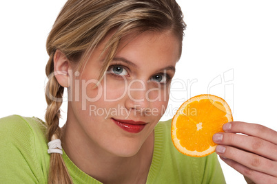 Healthy lifestyle series - Woman holding slice of orange