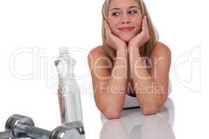 Fitness series - Attractive woman with weights and bottle of wat