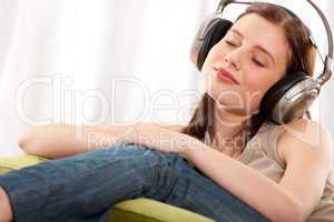 Student series - Young brunette enjoying music