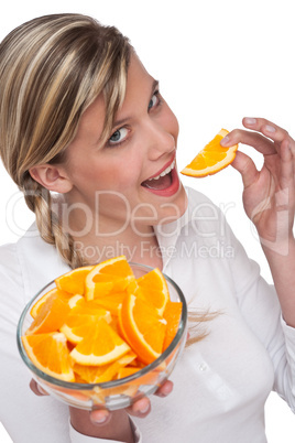 Healthy lifestyle series - Woman eating orange