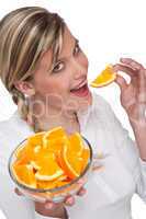 Healthy lifestyle series - Woman eating orange