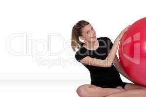 Fitness - Young woman with exercise ball on white