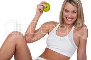 Fitness series - Smiling woman with green apple