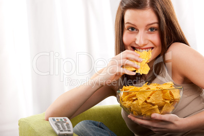 Student series - Young woman eating potato chips