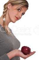 Healthy lifestyle series - Woman holding red apple