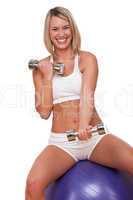 Fitness series - Smiling blond woman exercising with weights