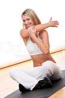 Fitness series - Smiling woman stretching