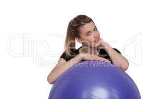 Fitness - Young woman with exercise ball on white