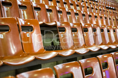 rows of seats with broken one