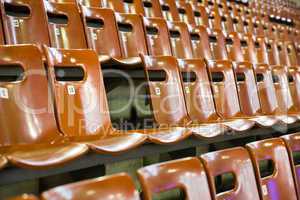 rows of seats with broken one