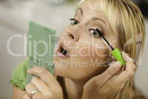 Blonde Woman Applying Her Mascara