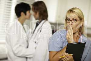 Alarmed Medical Woman Witnesses Colleagues Inner Office Romance.