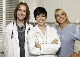 Three Smiling Male and Female Doctors or Nurses
