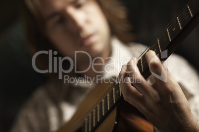 Young Musician Plays His Acoustic Guitar