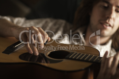 Young Musician Plays His Acoustic Guitar