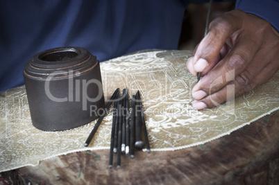 Traditional craftsman carving wood