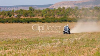 Tractor plowed wheat field