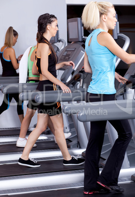 ladies jogging on trademill