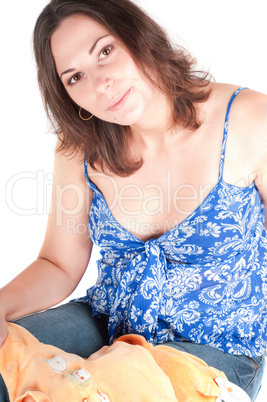 Portrait of pretty pregnant woman baby clothes