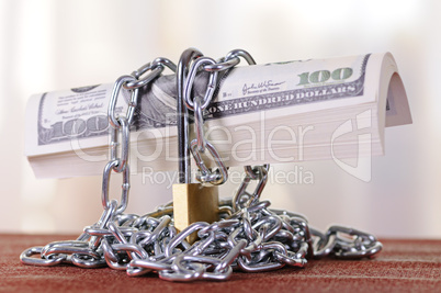 padlock with dollars