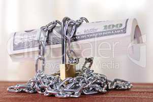 padlock with dollars