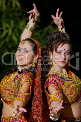 two young woman dance - indian cloth