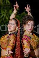 two young woman dance - indian cloth