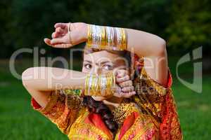 A young Indian woman hiding face
