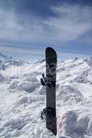Snowboard against the hight mountains