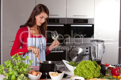 Pretty woman stirring in the pan