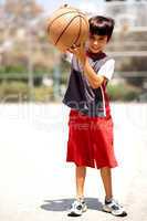 Adorable boy with basketball