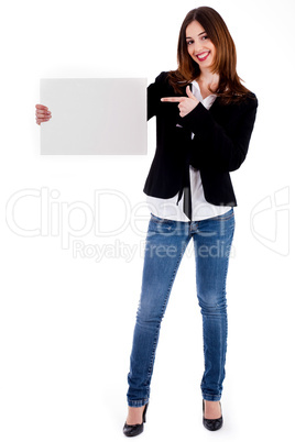 young lady pointing at blank board