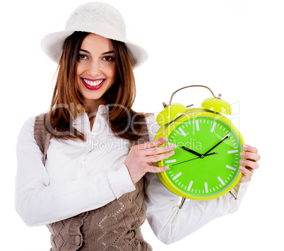 stylish lady holding alarm clock
