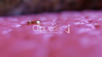 Wedding rings on the bed