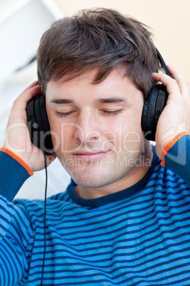 man listening music closing his eyes