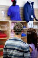 couple looking at men clothes