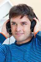 man listening music with earphones
