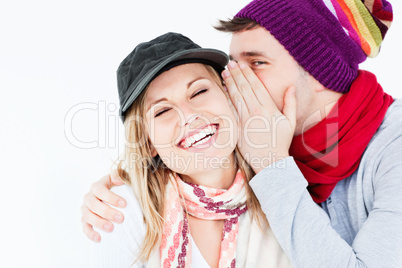 Young couple sharing a secret