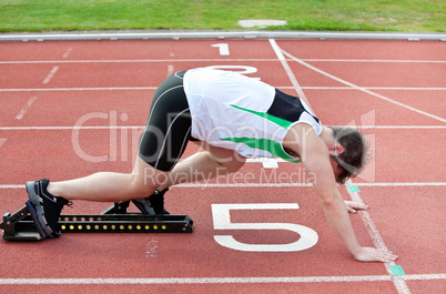 athletic man on the starting line