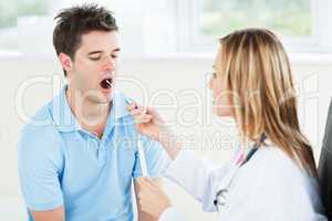 Female doctor extracting saliva