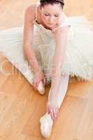 ballerina stretching on the floor