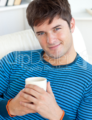 happy man resting on his couch