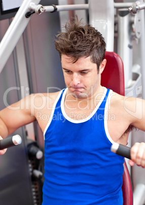 man working hard on a bench press