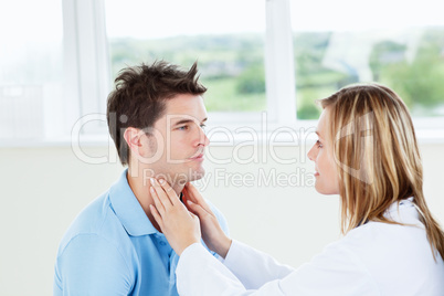 Female doctor examinating her male patient