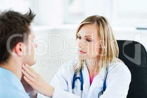 Doctor examinating her male patient