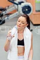 cute athletic woman drinking water